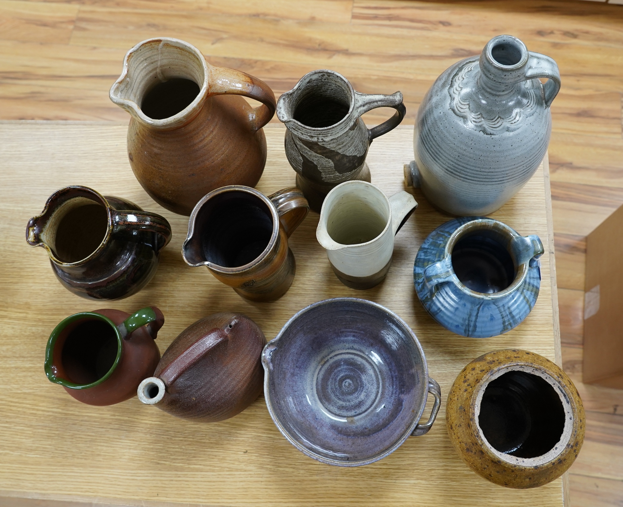 Nine studio pottery jugs, a vase and a bowl, etc. (11)